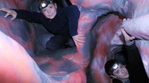 Boys with headlights in a tunnel 