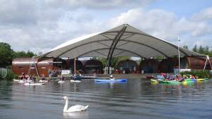 People kayaking and canoeing at Whitlingham Outdoor Education Centre in Norwich
