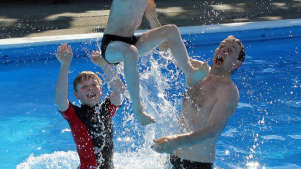 Family playing at Lazonby Swimming Pool in Penrith