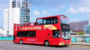Passengers on City Sightseeing Belfast Hop on Hop off Tour bus
