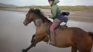 Woman horse riding at Dingle Horse Riding