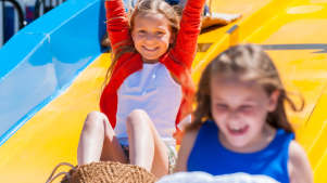 Girls on slides at Harbour Park in Littlehampton