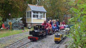 Families on train at Mizens Railway in Woking