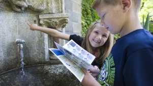 Kids looking for clues on Bournville Treasure Hunt Trail