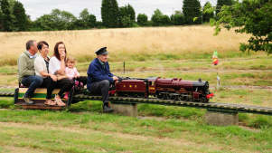 Family on miniature train at Summerfields Miniature Railways in Bedford