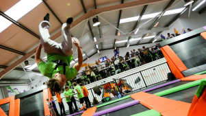 Boy jumping on trampoline at Bounce Central UK in Manchester