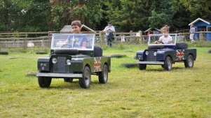Kids in toy cars at Park Hall Countryside Experience in Oswestry