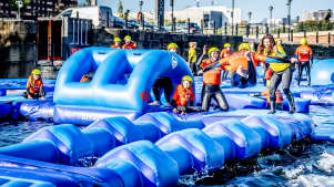 Kids on inflatable course at Adventure Dock Co. in Liverpool