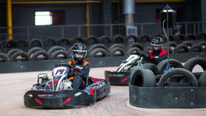 People go kart racing at TeamSport Indoor Karting Cardiff