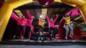 A group of girls mid jump at Jump Inc Inflatable and Trampoline Park in Lincoln 
