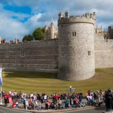 aerial view of windsor castle with people lining the streets