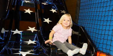 Little girl on the slide at Rush Trampoline Park High Wycombe