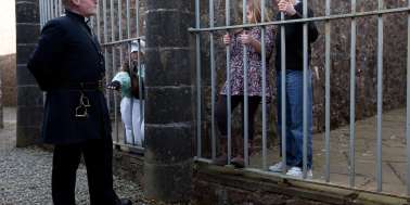 Guard looking at kids in cell at Inveraray Jail