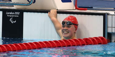 Woman in swimming pool at London Aquatics Centre