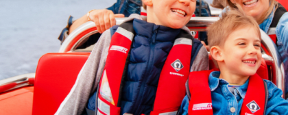 family on a speed boat