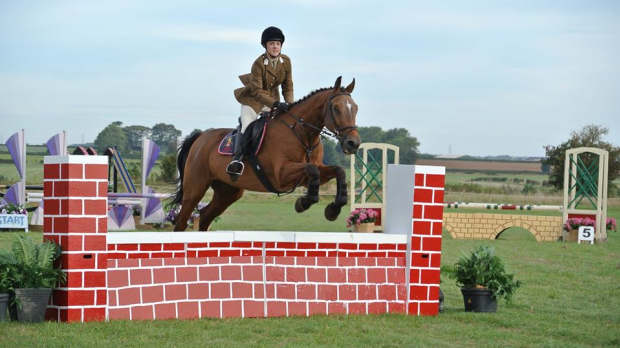 Woman horse riding at Cotswolds Riding in Stanton