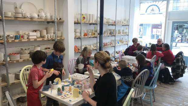 Families painting at Pitter Potter in Putney