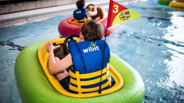 Boy in inflatable boat at Polar Adventure and Pool in Maidstone