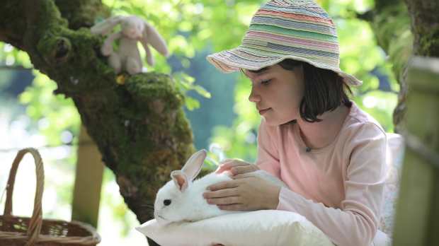Girl holding bunny at The Little Explorers Activity Club in market Harborough