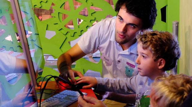 Kids playing on computers at Portland Basin Museum in Ashton-under-Lyne