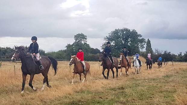 People riding horses at Aldborough Hall Equestrian Centre in Ilford