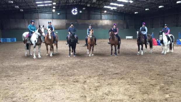People on horse back at Woodland Park Equestrian Centre in South Walsham