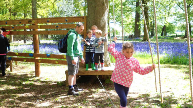 Girl on low rope course at Umberslade Adventure in Hockley Heath