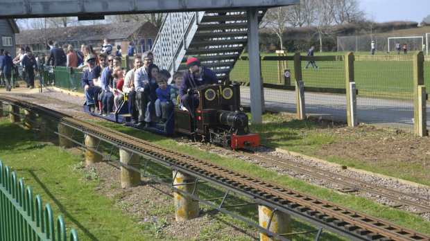 Families on train at Cutteslowe Park and Miniature Railway in Oxford