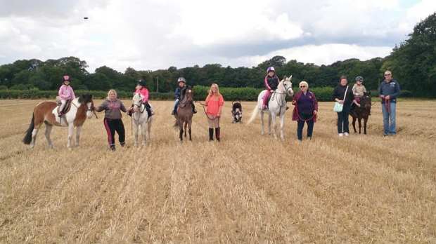 People trekking on horse riding at Willow Farm Riding School in Great Yarmouth