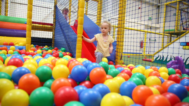 Girl in ball pit at Snakes and Ladders Dunstable