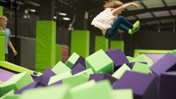 Girl jumping into foam pit at Jump Giants Newcastle in Gateshead