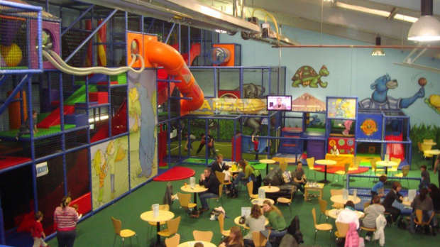 Indoor soft play area and seating area at Run Around Playcentre in Wrexham