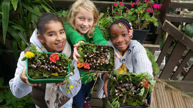 Girls gardening at Surrey Docks Farm in London