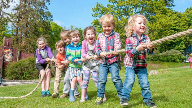 Kids tugging rope at Kelburn Castle Country Centre in Fairlie