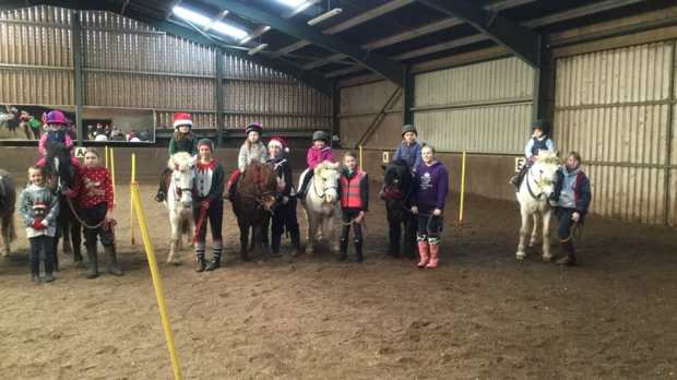 Kids with horses at Nenthorn Equestrian Centre in Kelso