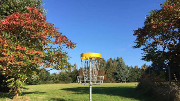 Disc golf basket at Quarry Park Disc Golf in Leamington Spa