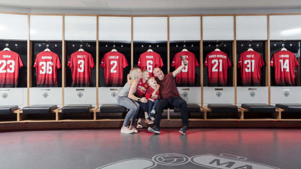 Family taking a photo at Manchester United Museum