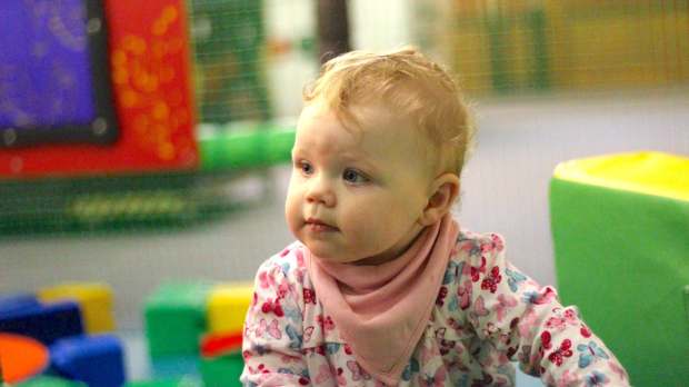 Baby playing at Warren Farm Holiday Centre in Burnham-on-Sea