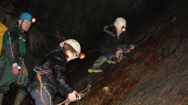 Girls in tunnel at Corris Mine Explorers in Machynlleth