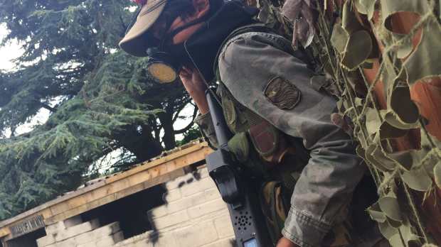 Boy paintballing at Clambers Play Centre & Battle Zone in Hastings