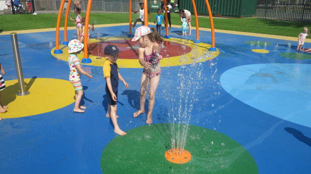 Kids playing in water area at Wimbledon Sprinkler Park in Merton
