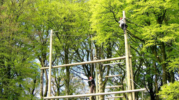 Person on high rope course at Kippure Adventure Centre in Blessington