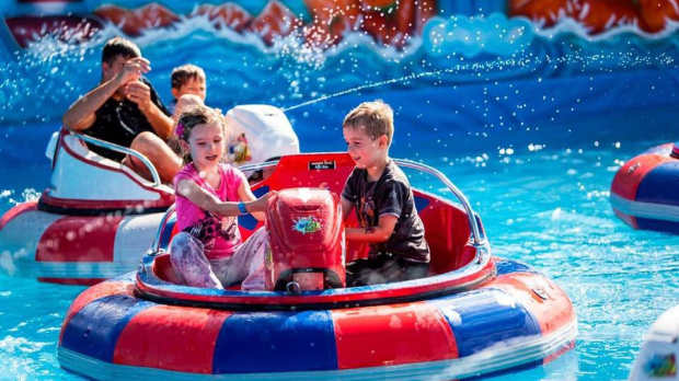 Kids on Crazy boats at Fun City at Brean Leisure Park in Burnham on Sea