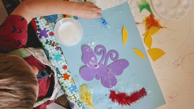 Boy doing craft at Bish Bash Pot in York
