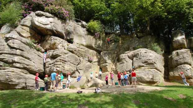 Families rock climbing at Bowles Outdoor Activity Centre in Tunbridge Wells