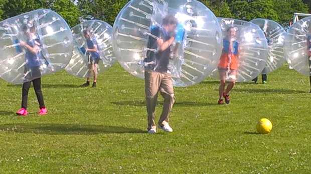 Kids playing zorb football at Haverhill Leisure Centre