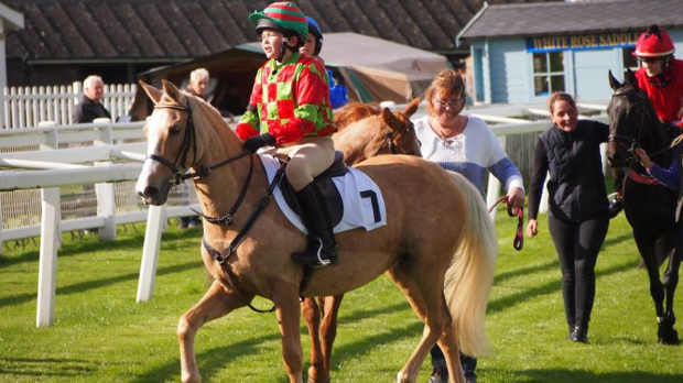 Rider and horse on course at Croxteth Park Riding Centre in Liverpool