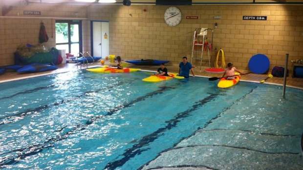 People kayaking on swimming pool at Lochbroom Leisure Centre in Ullapool