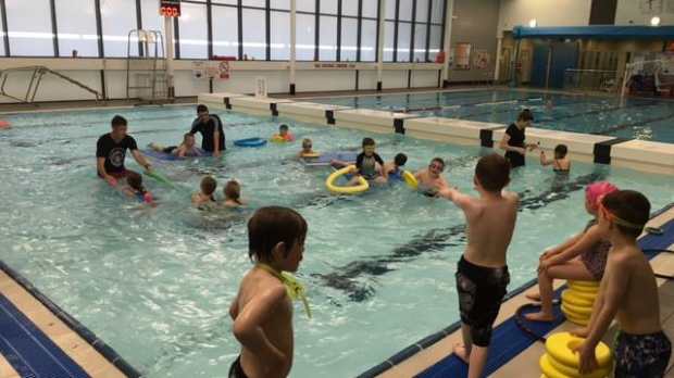 Families in swimming pool at Lewis Sports Centre in Isle of Lewis