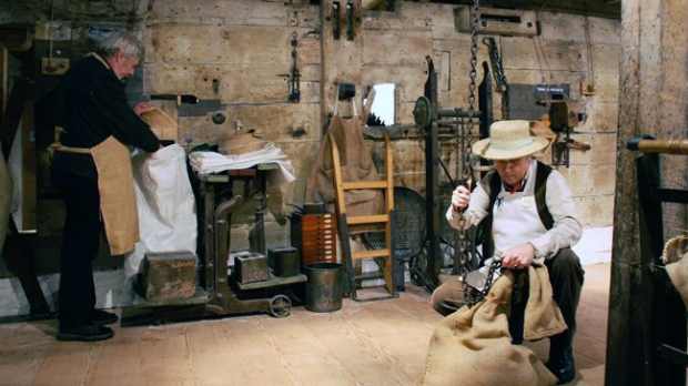 Men perform tasks at Cogglesford Mill in Sleaford